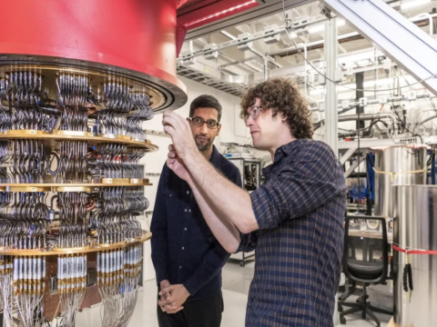 Two men working on a quantum computer