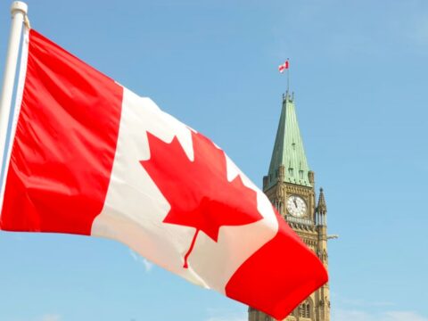Canadian flag over Parliament Hill